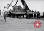 Image of F4U airplanes being moved on USS Badoeng Strait (CVE – 116) Pacific Ocean, 1950, second 38 stock footage video 65675040316