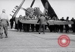 Image of F4U airplanes being moved on USS Badoeng Strait (CVE – 116) Pacific Ocean, 1950, second 41 stock footage video 65675040316