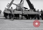 Image of F4U airplanes being moved on USS Badoeng Strait (CVE – 116) Pacific Ocean, 1950, second 44 stock footage video 65675040316