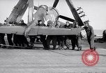 Image of F4U airplanes being moved on USS Badoeng Strait (CVE – 116) Pacific Ocean, 1950, second 47 stock footage video 65675040316