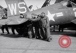 Image of F4U airplanes being moved on USS Badoeng Strait (CVE – 116) Pacific Ocean, 1950, second 52 stock footage video 65675040316