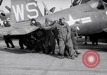 Image of F4U airplanes being moved on USS Badoeng Strait (CVE – 116) Pacific Ocean, 1950, second 53 stock footage video 65675040316