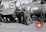 Image of F4U airplanes being moved on USS Badoeng Strait (CVE – 116) Pacific Ocean, 1950, second 54 stock footage video 65675040316