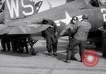 Image of F4U airplanes being moved on USS Badoeng Strait (CVE – 116) Pacific Ocean, 1950, second 58 stock footage video 65675040316