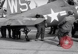 Image of F4U airplanes being moved on USS Badoeng Strait (CVE – 116) Pacific Ocean, 1950, second 59 stock footage video 65675040316