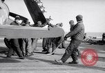 Image of F4U airplanes being moved on USS Badoeng Strait (CVE – 116) Pacific Ocean, 1950, second 60 stock footage video 65675040316