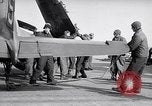 Image of F4U airplanes being moved on USS Badoeng Strait (CVE – 116) Pacific Ocean, 1950, second 61 stock footage video 65675040316