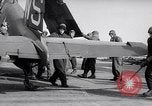 Image of F4U airplanes being moved on USS Badoeng Strait (CVE – 116) Pacific Ocean, 1950, second 62 stock footage video 65675040316