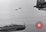 Image of Ships and planes of invasion task force practice maneuvers Pacific Ocean, 1944, second 19 stock footage video 65675040322