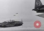 Image of Ships and planes of invasion task force practice maneuvers Pacific Ocean, 1944, second 32 stock footage video 65675040322