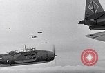 Image of Ships and planes of invasion task force practice maneuvers Pacific Ocean, 1944, second 33 stock footage video 65675040322