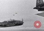 Image of Ships and planes of invasion task force practice maneuvers Pacific Ocean, 1944, second 34 stock footage video 65675040322