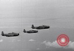 Image of Ships and planes of invasion task force practice maneuvers Pacific Ocean, 1944, second 48 stock footage video 65675040322