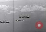 Image of Ships and planes of invasion task force practice maneuvers Pacific Ocean, 1944, second 54 stock footage video 65675040322