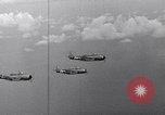 Image of Ships and planes of invasion task force practice maneuvers Pacific Ocean, 1944, second 56 stock footage video 65675040322