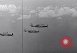 Image of Ships and planes of invasion task force practice maneuvers Pacific Ocean, 1944, second 57 stock footage video 65675040322