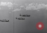 Image of Ships and planes of invasion task force practice maneuvers Pacific Ocean, 1944, second 58 stock footage video 65675040322