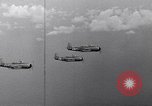 Image of Ships and planes of invasion task force practice maneuvers Pacific Ocean, 1944, second 59 stock footage video 65675040322