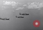 Image of Ships and planes of invasion task force practice maneuvers Pacific Ocean, 1944, second 61 stock footage video 65675040322