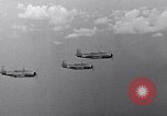 Image of Ships and planes of invasion task force practice maneuvers Pacific Ocean, 1944, second 62 stock footage video 65675040322