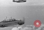 Image of TBF and F4F Wildcat in practice maneuvers with Peleliu Task Force Pacific Ocean, 1944, second 5 stock footage video 65675040323
