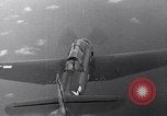 Image of TBF and F4F Wildcat in practice maneuvers with Peleliu Task Force Pacific Ocean, 1944, second 30 stock footage video 65675040323