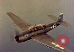 Image of U.S. Navy Grumman TBF avenger aircraft attacking Japanese Iwo Jima, 1945, second 33 stock footage video 65675040325