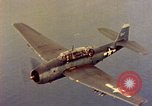 Image of U.S. Navy Grumman TBF avenger aircraft attacking Japanese Iwo Jima, 1945, second 34 stock footage video 65675040325