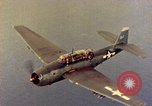 Image of U.S. Navy Grumman TBF avenger aircraft attacking Japanese Iwo Jima, 1945, second 35 stock footage video 65675040325