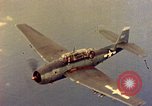 Image of U.S. Navy Grumman TBF avenger aircraft attacking Japanese Iwo Jima, 1945, second 38 stock footage video 65675040325