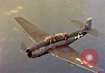 Image of U.S. Navy Grumman TBF avenger aircraft attacking Japanese Iwo Jima, 1945, second 42 stock footage video 65675040325