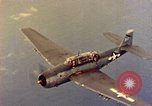 Image of U.S. Navy Grumman TBF avenger aircraft attacking Japanese Iwo Jima, 1945, second 43 stock footage video 65675040325