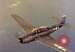 Image of U.S. Navy Grumman TBF avenger aircraft attacking Japanese Iwo Jima, 1945, second 44 stock footage video 65675040325