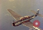 Image of U.S. Navy Grumman TBF avenger aircraft attacking Japanese Iwo Jima, 1945, second 48 stock footage video 65675040325