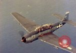 Image of U.S. Navy Grumman TBF avenger aircraft attacking Japanese Iwo Jima, 1945, second 51 stock footage video 65675040325