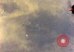 Image of U.S. Navy Grumman TBF avenger aircraft attacking Japanese Iwo Jima, 1945, second 56 stock footage video 65675040325