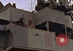 Image of General Motors FM-2 Wildcat aircraft landing on escort carrier Iwo Jima, 1945, second 12 stock footage video 65675040327