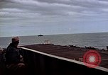 Image of General Motors FM-2 Wildcat aircraft landing on escort carrier Iwo Jima, 1945, second 26 stock footage video 65675040327
