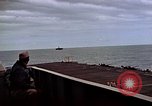 Image of General Motors FM-2 Wildcat aircraft landing on escort carrier Iwo Jima, 1945, second 27 stock footage video 65675040327