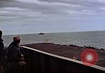 Image of General Motors FM-2 Wildcat aircraft landing on escort carrier Iwo Jima, 1945, second 28 stock footage video 65675040327