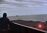 Image of General Motors FM-2 Wildcat aircraft landing on escort carrier Iwo Jima, 1945, second 29 stock footage video 65675040327