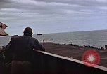 Image of General Motors FM-2 Wildcat aircraft landing on escort carrier Iwo Jima, 1945, second 30 stock footage video 65675040327