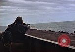 Image of General Motors FM-2 Wildcat aircraft landing on escort carrier Iwo Jima, 1945, second 31 stock footage video 65675040327