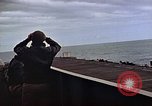 Image of General Motors FM-2 Wildcat aircraft landing on escort carrier Iwo Jima, 1945, second 32 stock footage video 65675040327