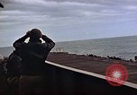 Image of General Motors FM-2 Wildcat aircraft landing on escort carrier Iwo Jima, 1945, second 33 stock footage video 65675040327
