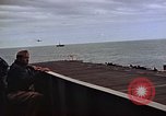 Image of General Motors FM-2 Wildcat aircraft landing on escort carrier Iwo Jima, 1945, second 35 stock footage video 65675040327