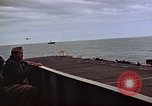 Image of General Motors FM-2 Wildcat aircraft landing on escort carrier Iwo Jima, 1945, second 36 stock footage video 65675040327