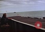 Image of General Motors FM-2 Wildcat aircraft landing on escort carrier Iwo Jima, 1945, second 37 stock footage video 65675040327