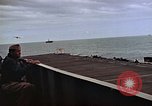 Image of General Motors FM-2 Wildcat aircraft landing on escort carrier Iwo Jima, 1945, second 38 stock footage video 65675040327