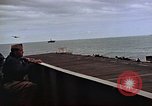 Image of General Motors FM-2 Wildcat aircraft landing on escort carrier Iwo Jima, 1945, second 39 stock footage video 65675040327